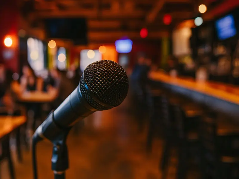 Close-up of a microphone with guests in the background during karaoke night at Wilson’s Grill in Hilliard, Ohio
