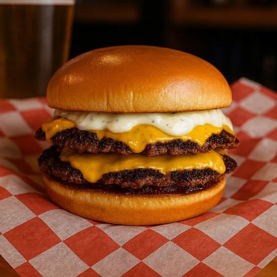 The Blackbeard smash burger with double seasoned beef patties, melted American cheese, and house sauce on a toasted bun at Wilson’s Bar & Grill in Hilliard Ohio