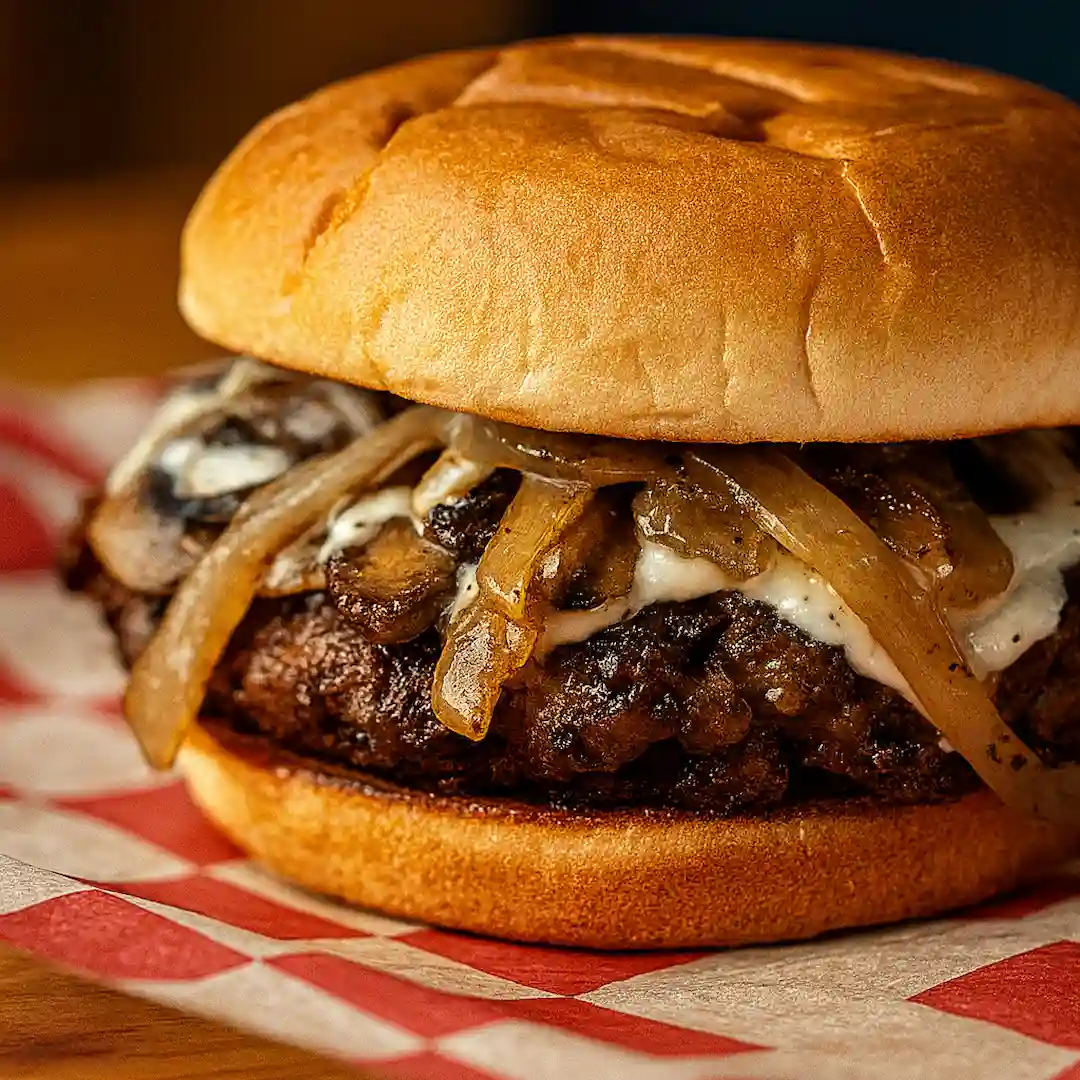 Steak Smash burger with Swiss cheese, sautéed mushrooms, sautéed onions, and mayo on a smash burger patty at Wilson’s Bar & Grill in Hilliard Ohio
