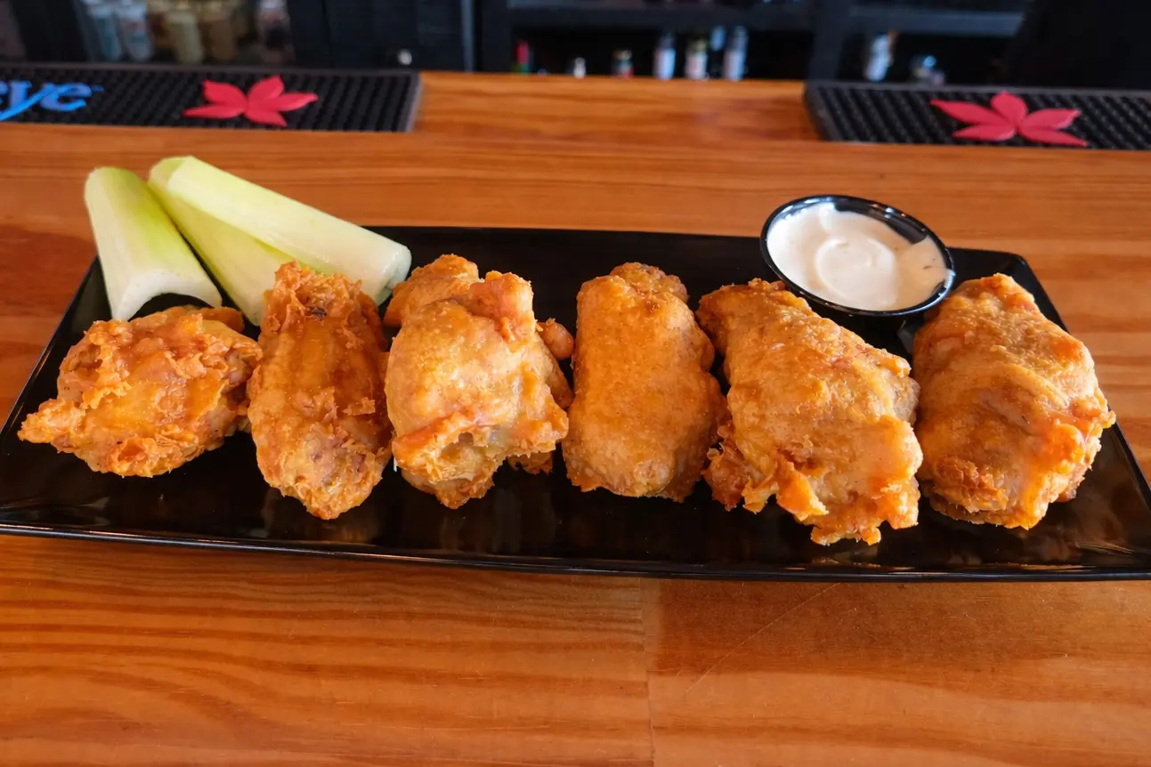 Traditional bone in chicken wings served with celery and ranch at a Hilliard Ohio bar and grill