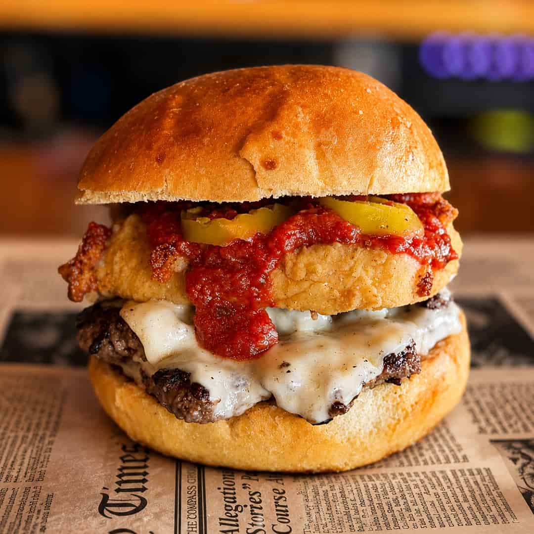 Fried Mozzarella Smash burger with Swiss-American cheese, hand-breaded fried mozzarella, marinara and grilled banana peppers at Wilson’s Bar & Grill in Hilliard, Ohio.