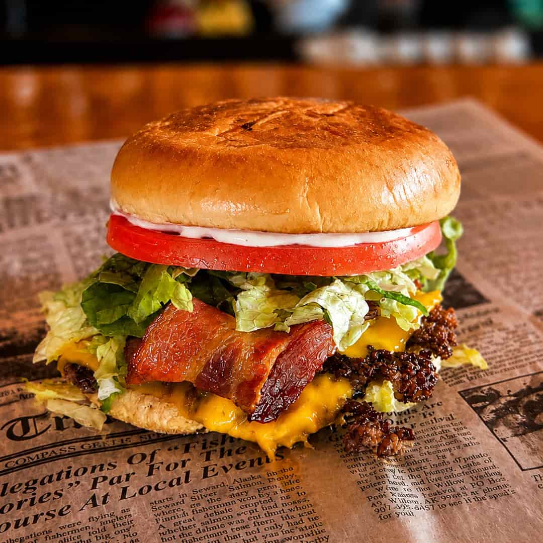 Jr. Bacon Smash Burger with American cheese, hardwood-smoked bacon, lettuce, tomato, onion, and mayo at Wilson’s Bar & Grill in Hilliard, Ohio.