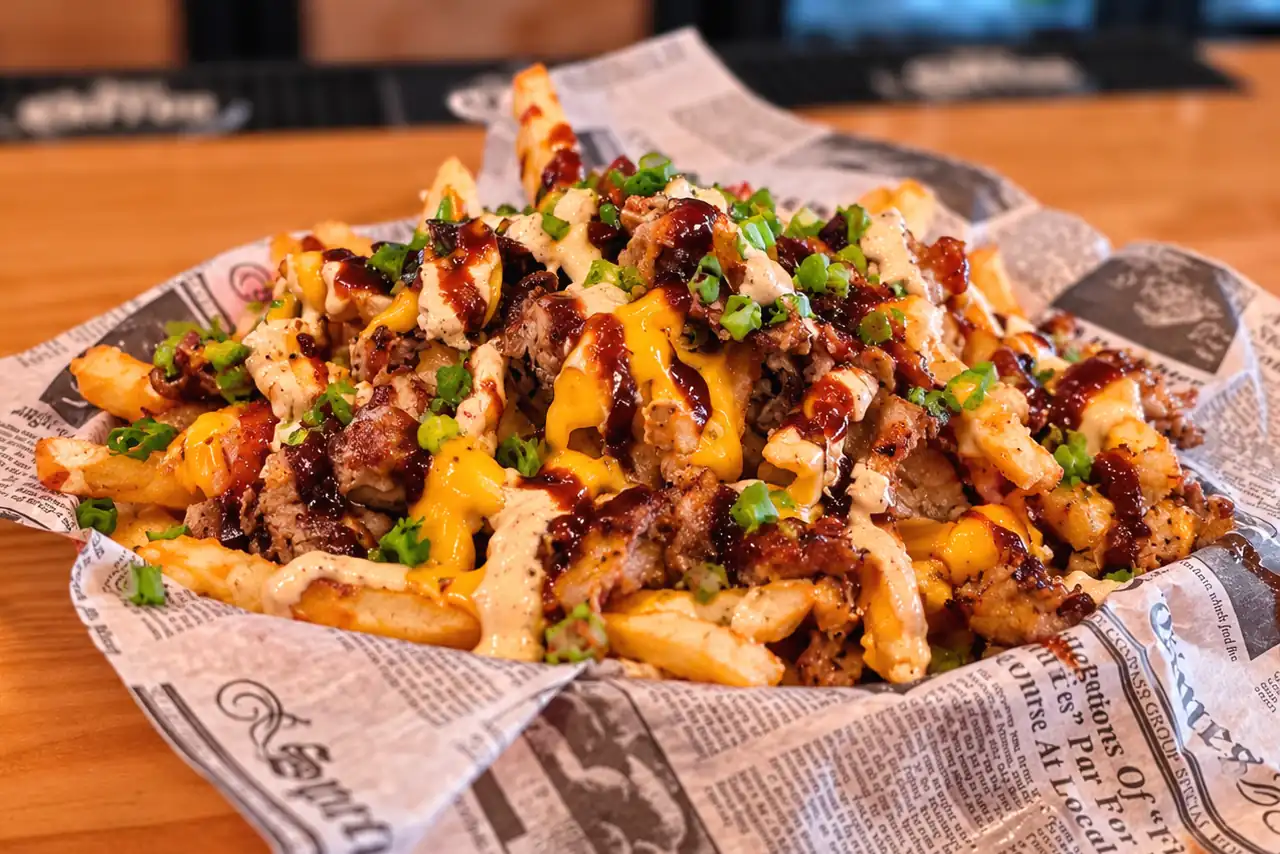 Heinz A1 Steakhouse Fries with ribeye, cheese, sauces, and chives at Wilson’s Bar & Grill in Hilliard, Ohio