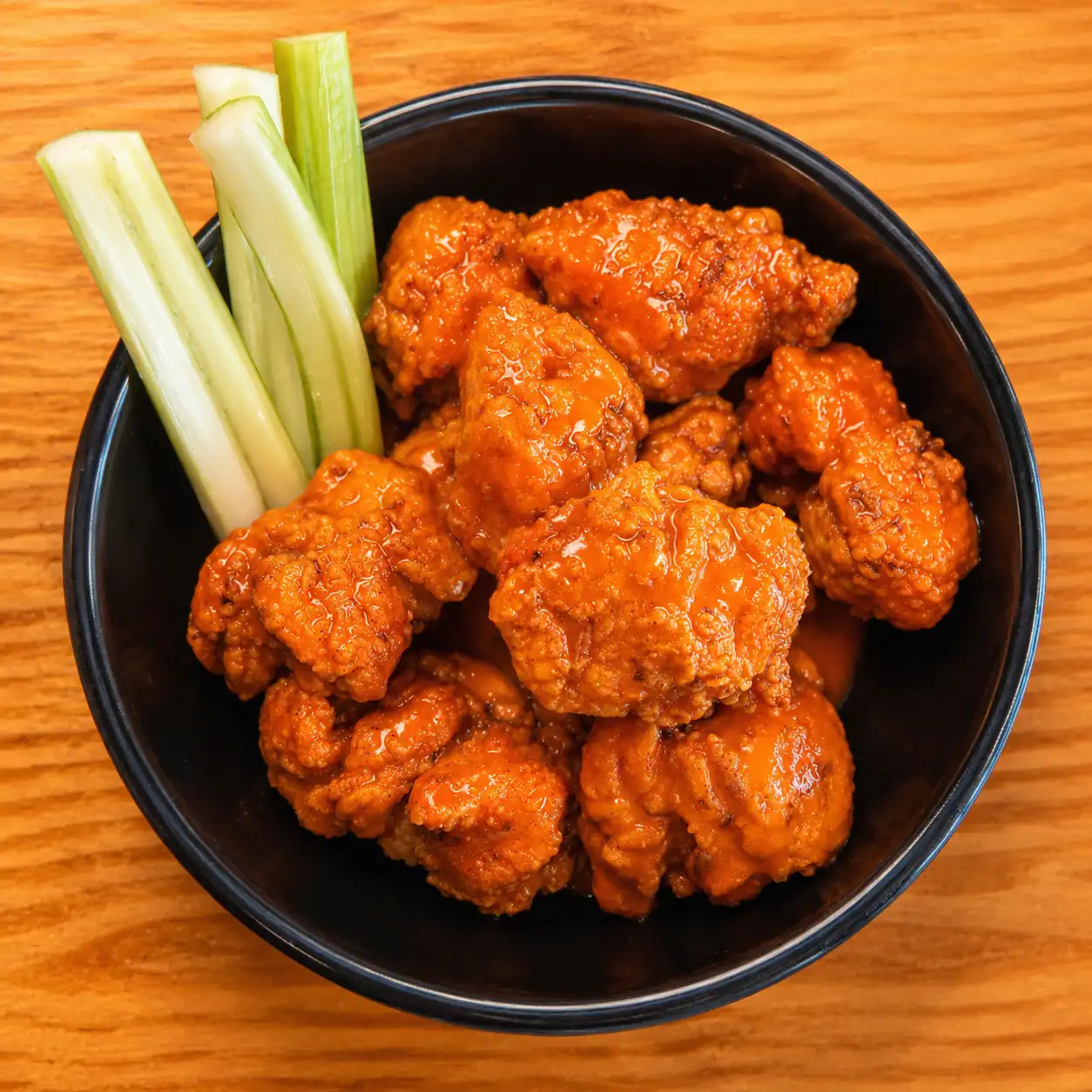 Overhead view of hand-breaded boneless Buffalo wings at Wilson’s Bar & Grill in Hilliard, Ohio