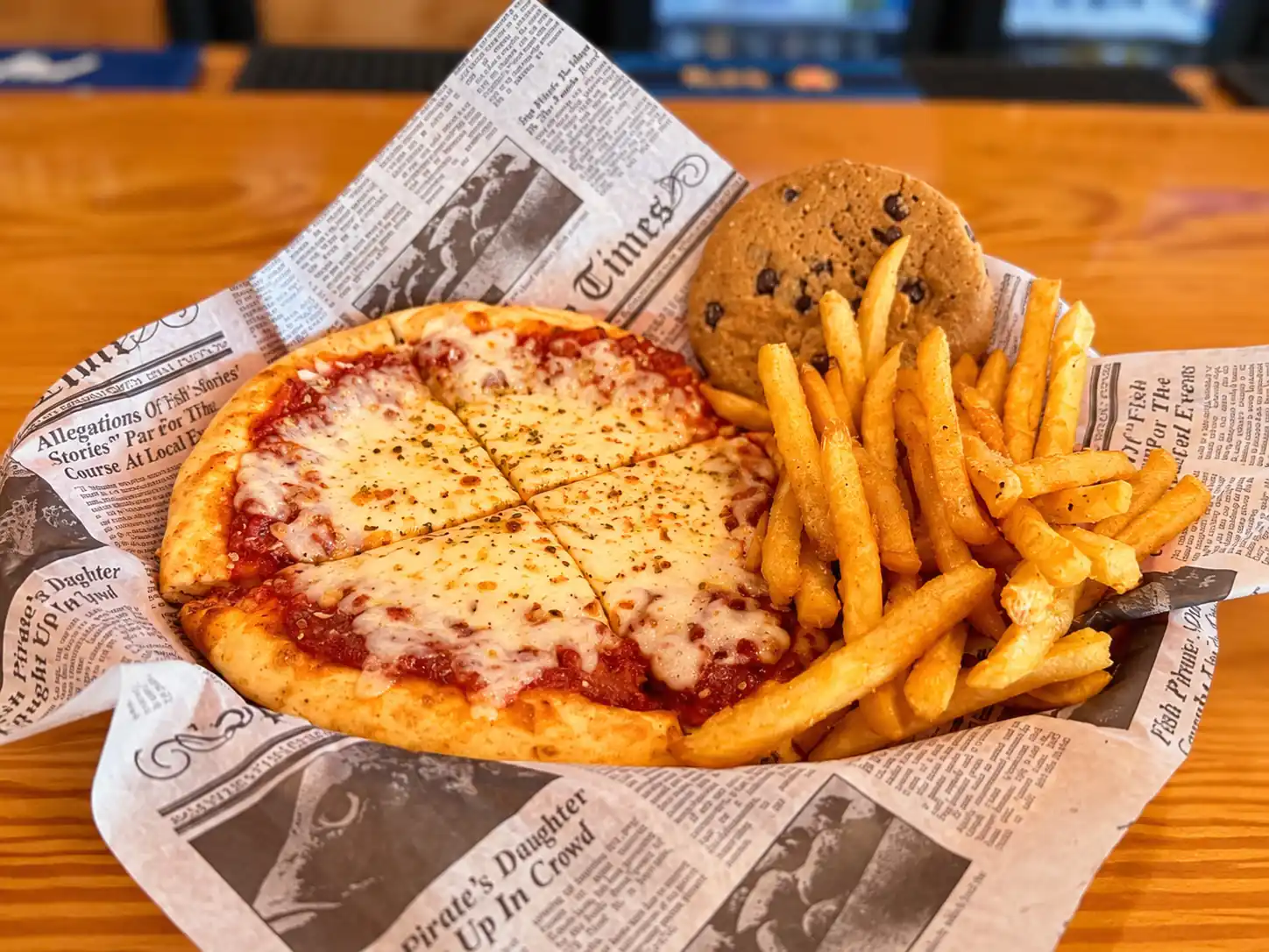 Kids cheese pizza with fries and a cookie at Wilson’s Bar & Grill in Hilliard, Ohio